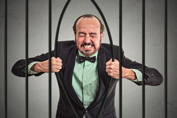 Image of a man bending bars - represents a schoolteacher who caught a break and is making a million dollars