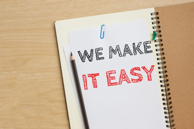 Image of a notepad with "we make it easy" written on it - Represents that our method makes it easy to kiss money stress goodbye